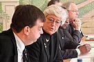 The Honourable Mrs Sara Morrison (Vice-President) talking to Mr André Hoffmann (Honorary Treasurer). Dr Claude Martin, WWF-International Director General (1993-2005), in the back. WWF International Board Meeting 12 December 2003, Glion, Switzerland.