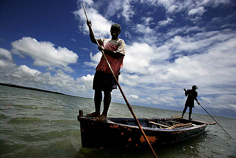 Fishermen doing the 'fish driving'. Tikina Wai, Fiji. There are two boats hitting the water to ...
© Brent Stirton / Getty Images rel=