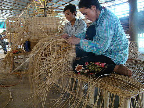 Rattan workers making a sofa at a rattan enterprise in rural Cambodia. / ©: Tep Asnarith / WWF-Cambodia rel=
