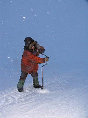 Drilling a hole in the ice for ice fishing.
© Tom Arnbom Drilling a hole in the ice for ice fishing.
© Tom Arnbom