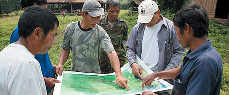 WWF team consults with local village chiefs on a sustainable forests project.
© Noy Promsouvanh / WWF Laos rel=