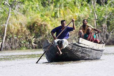 A group of fishermen in their boat in the Sundarbans National Park, Bangladesh.
© David Woodfall / WWF-UK rel=