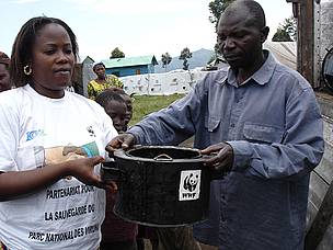 WWF staff member passing out an energy efficient stove in Eastern DRC. These stoves use less fuel ...
© Bruno Hugel
© Bruno Hugel